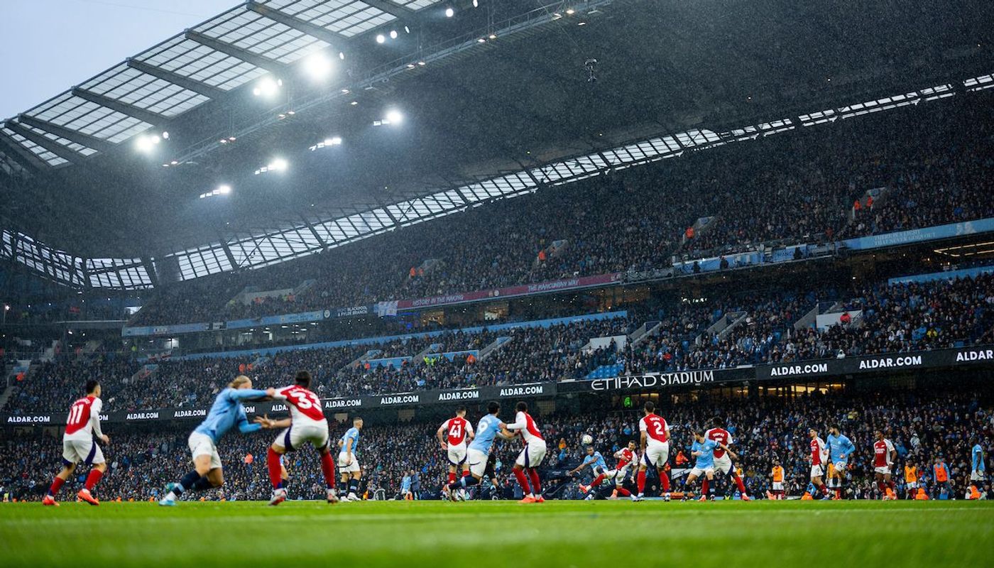 5. Man City and Arsenal players get to grips at the Etihad Stadium