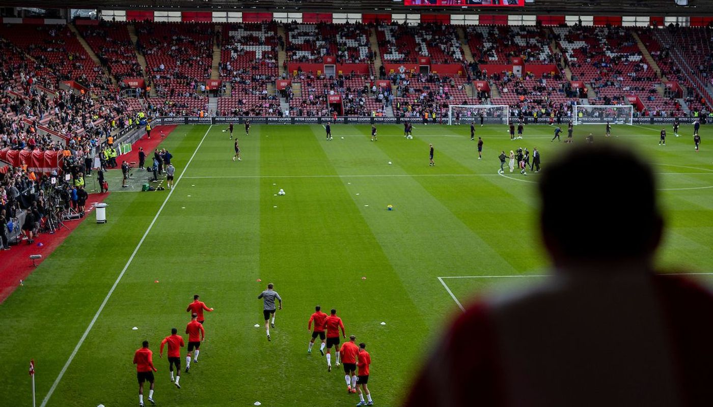 6. Warming up under watchful eyes at St Mary's Stadium